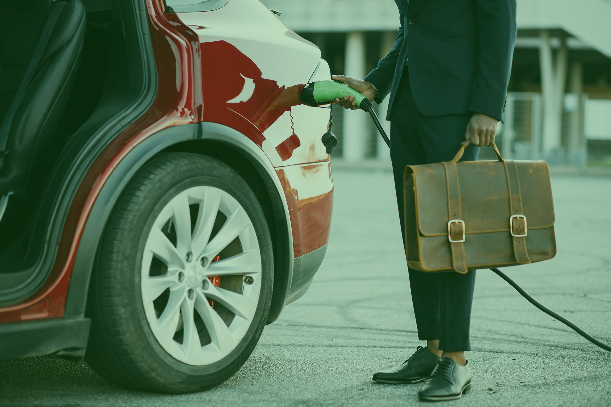 Person_charging_car_with_briefcase