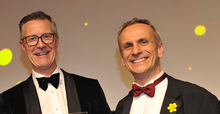 Ian Hughes, CEO - Corporate division collecting award