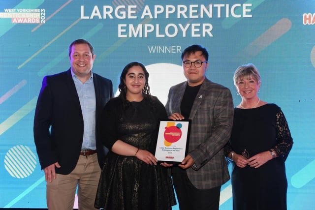 Nick Galicia collecting Largen Apprentice Employer of the year award