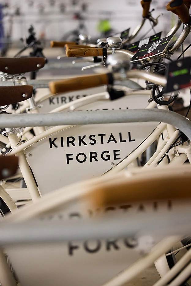 Bikes lined up with Kirkstall Forge logo