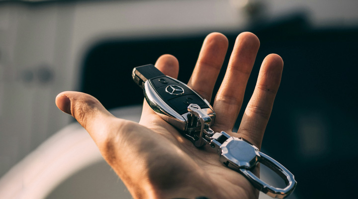 holding car keys