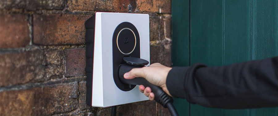 Person holding a ev charger