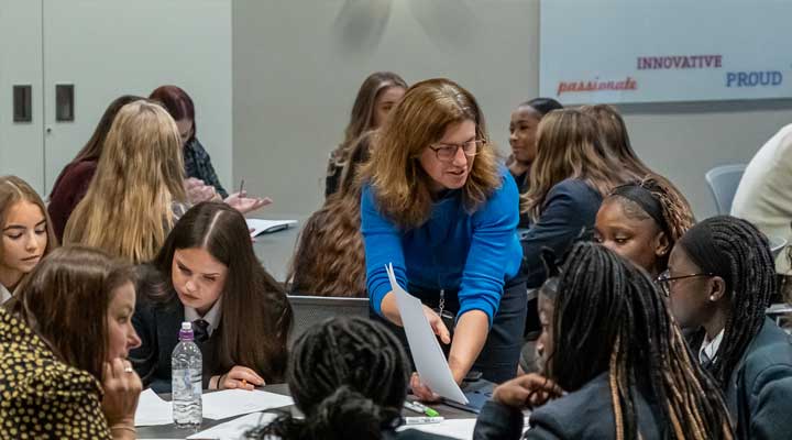 Lady sat in the car with the window down.