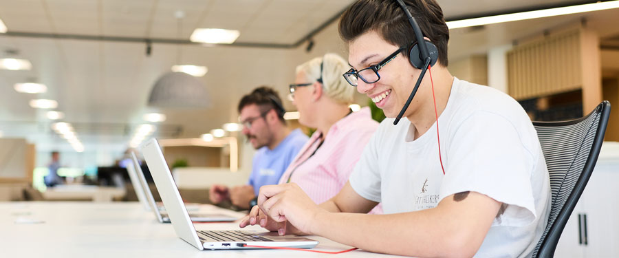 staff using headset helping customer.