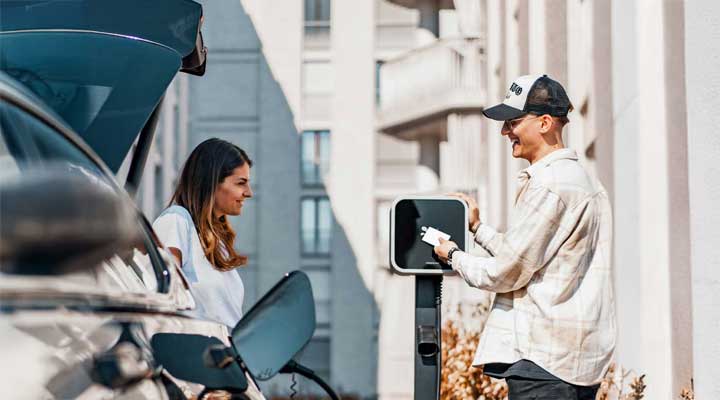 couple charging car.