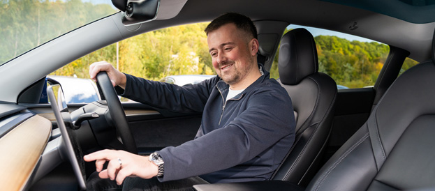 person inside the car, touching the screen.