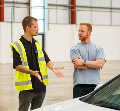 2 people talking and BiK being explained