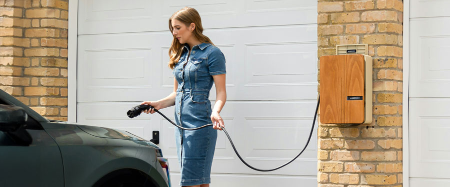 lady charging car at home