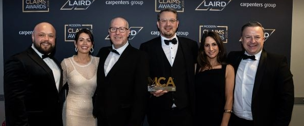 Team Zenith collecting their Modern Claims Award