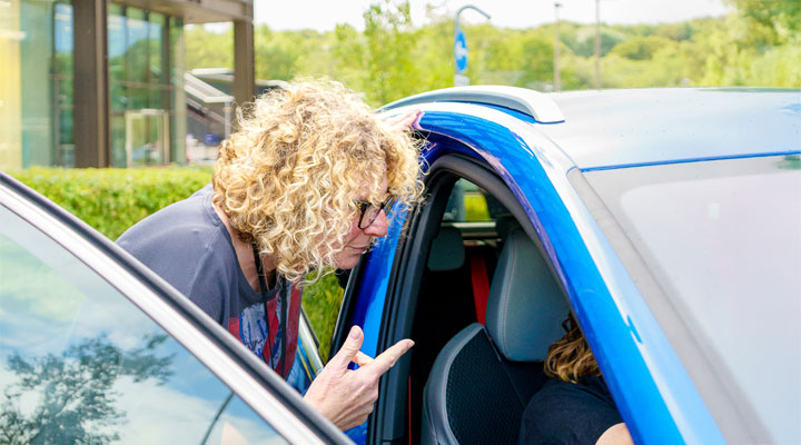 lady looking into the car