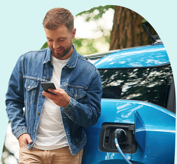 man leaning on his car