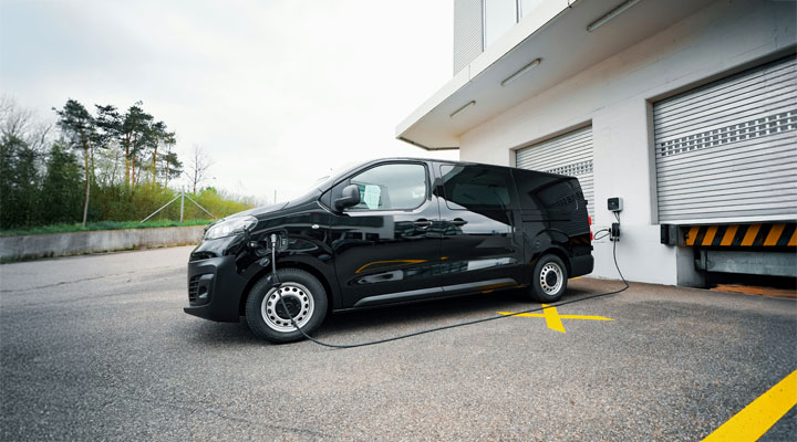 Ev van charging at a unit.