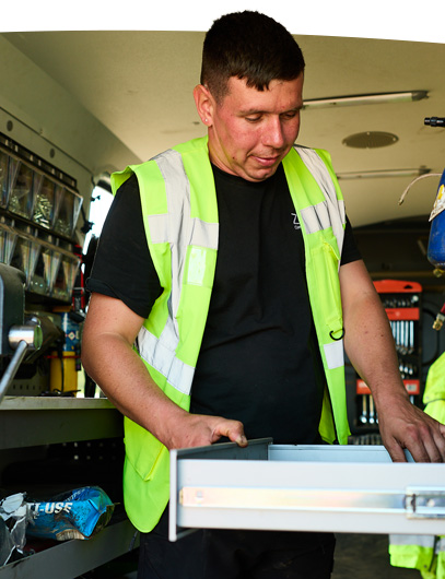 Man in a van working.
