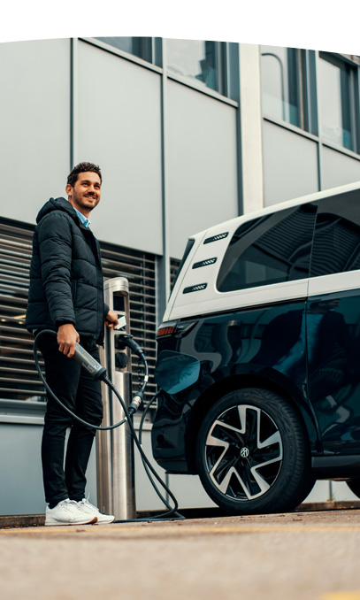 man charging his vehicle.