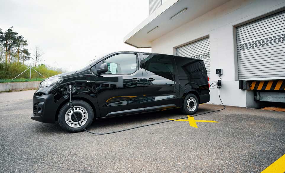 Ev van charging at a unit.