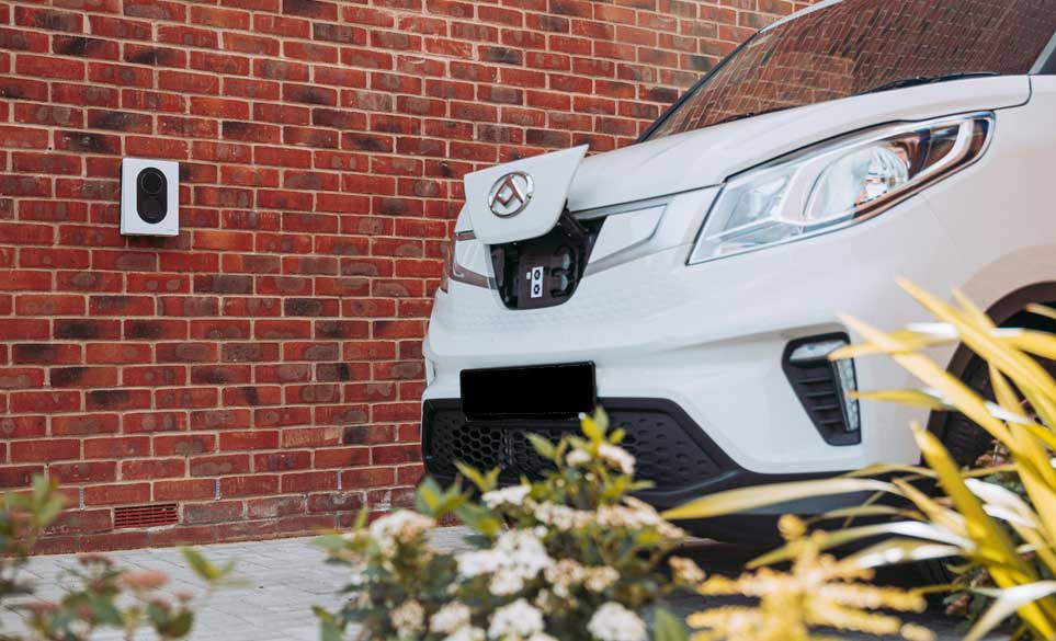 van parked near a ev charging port