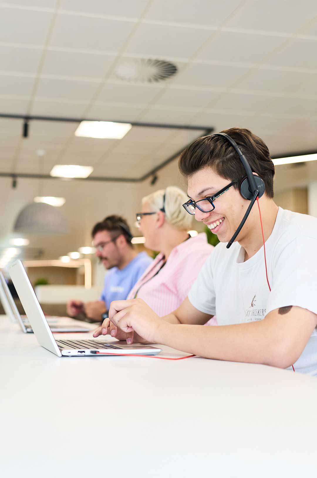 staff wearing headset helping