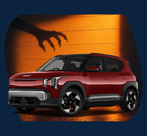 Kia EV2 in front of Halloween theme background